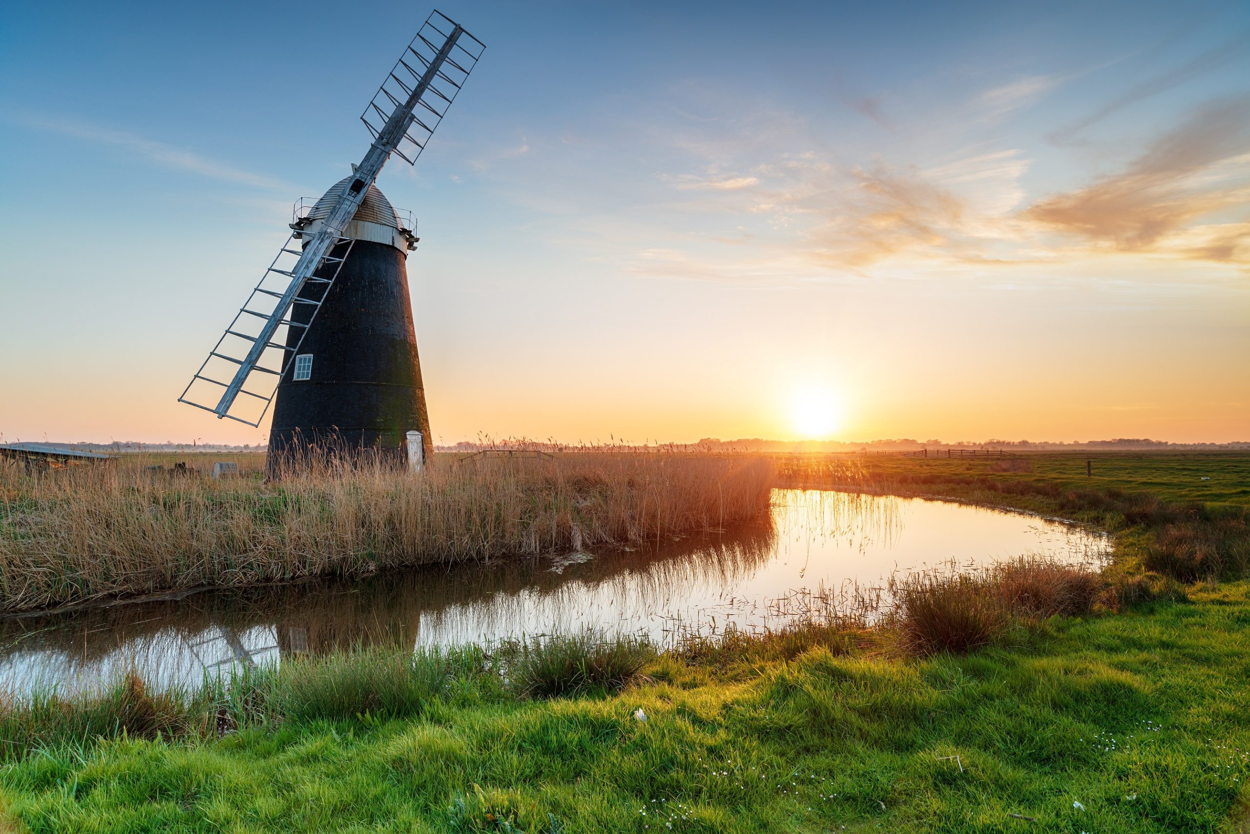 Picture of norfolk countryside, sunset behind Halvergate windmill